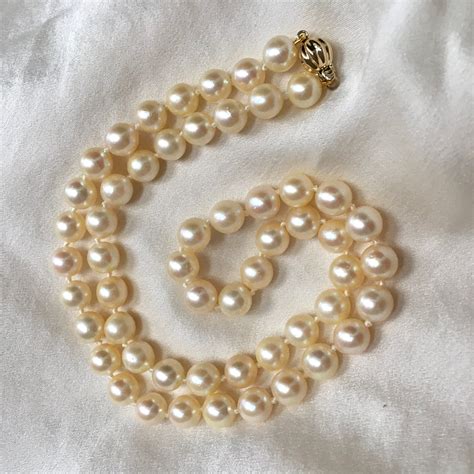 pearl necklace clasp says japan.